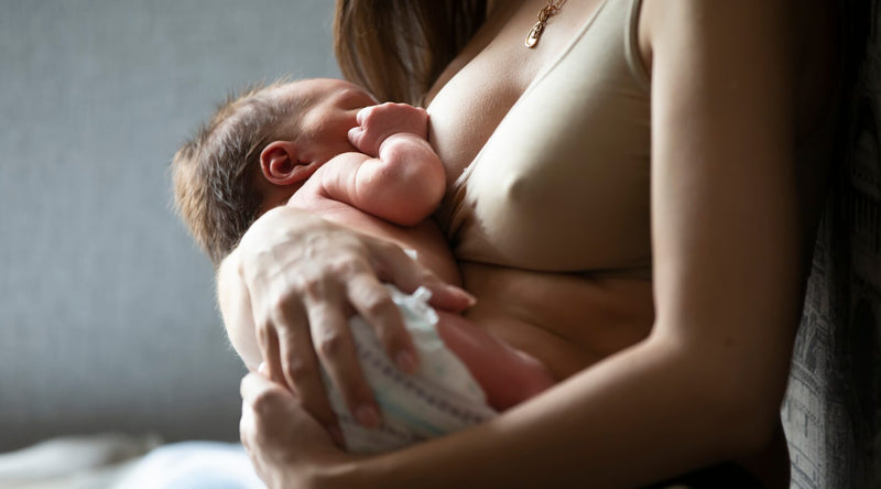 mom breastfeeding baby