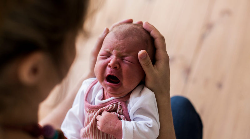 dad holding crying baby|google search results about baby colic|||read our blog baby colic|dr golly video about baby colic