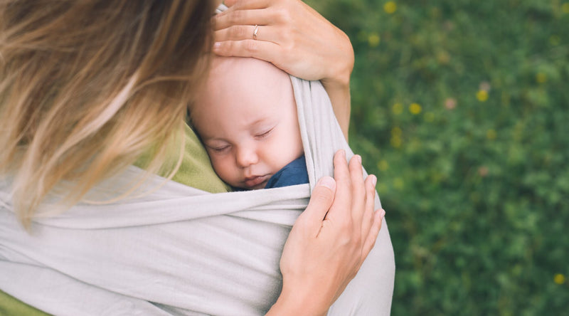 mom holding baby wrap