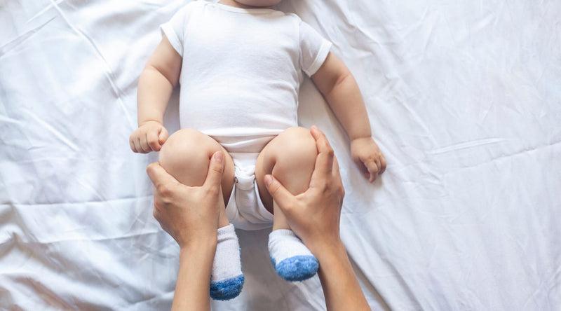 constipated baby|read our blog baby poo colours types|baby sipping|baby sipping bottle|baby drinking from bottle