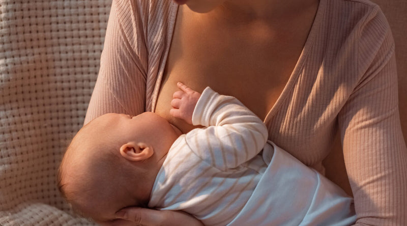 mom breastfeeding baby