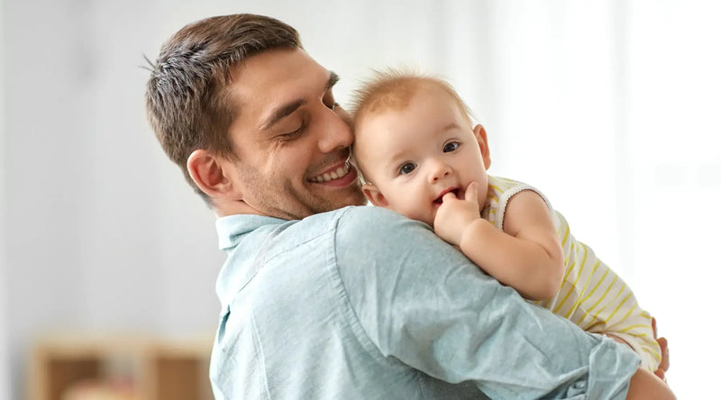 father and newborn