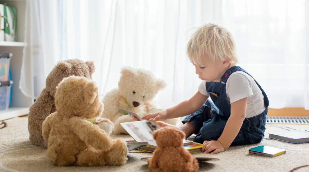 child with teddy bears